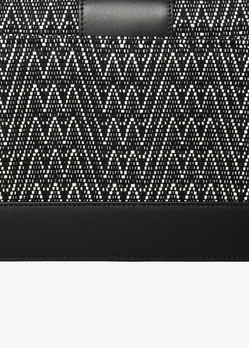 Close-up of Peak Noir handwoven cotton weave on Berlin Clutch