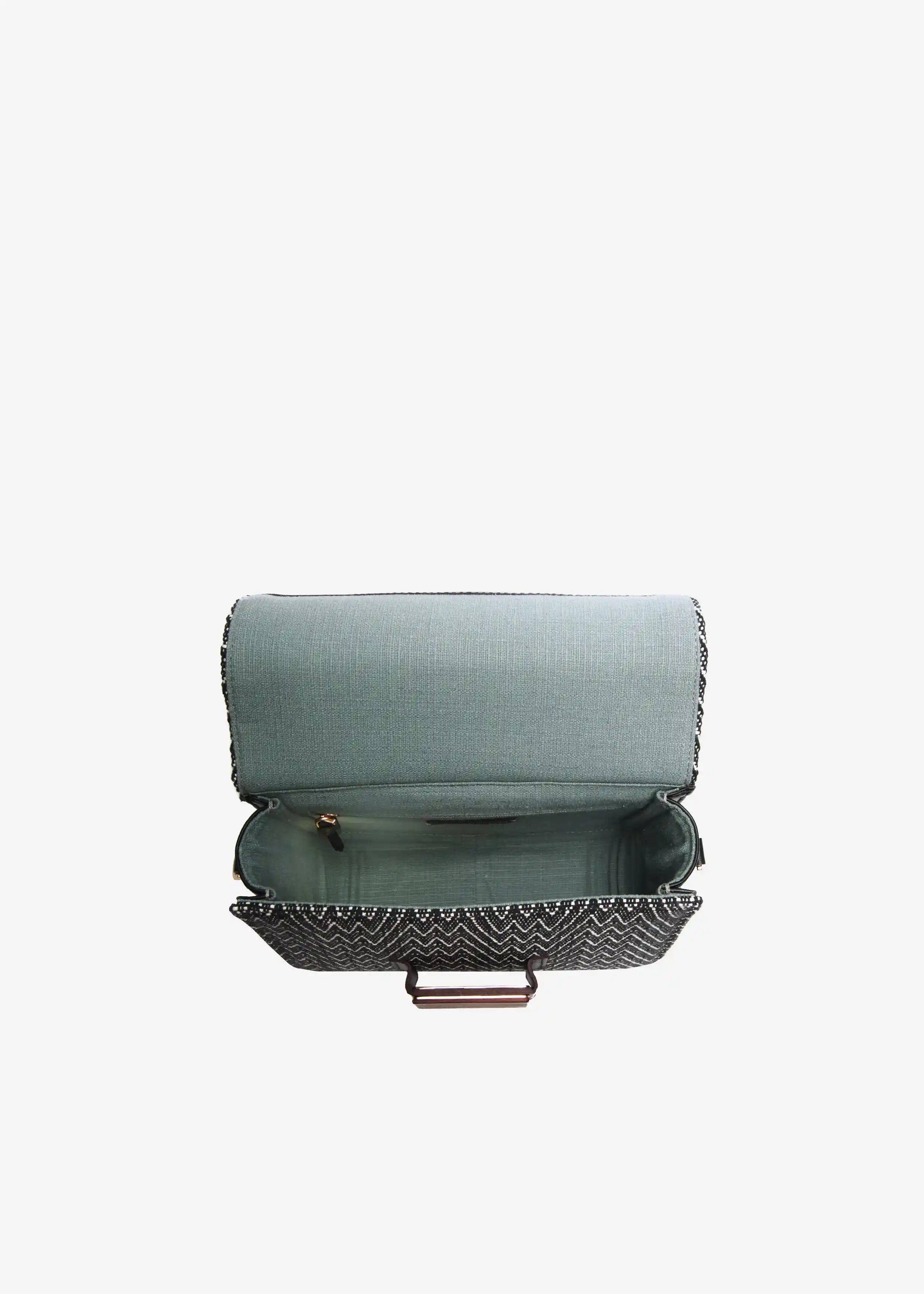 Berlin crossbody bag interior view showing fabric lining and structured base