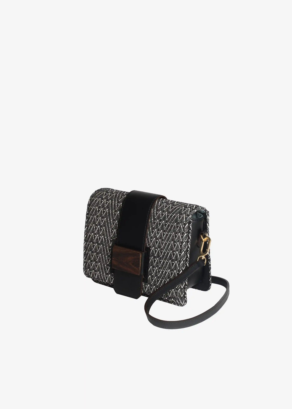 Berlin crossbody bag perspective view — handwoven Peak Noir cotton with black leather trim