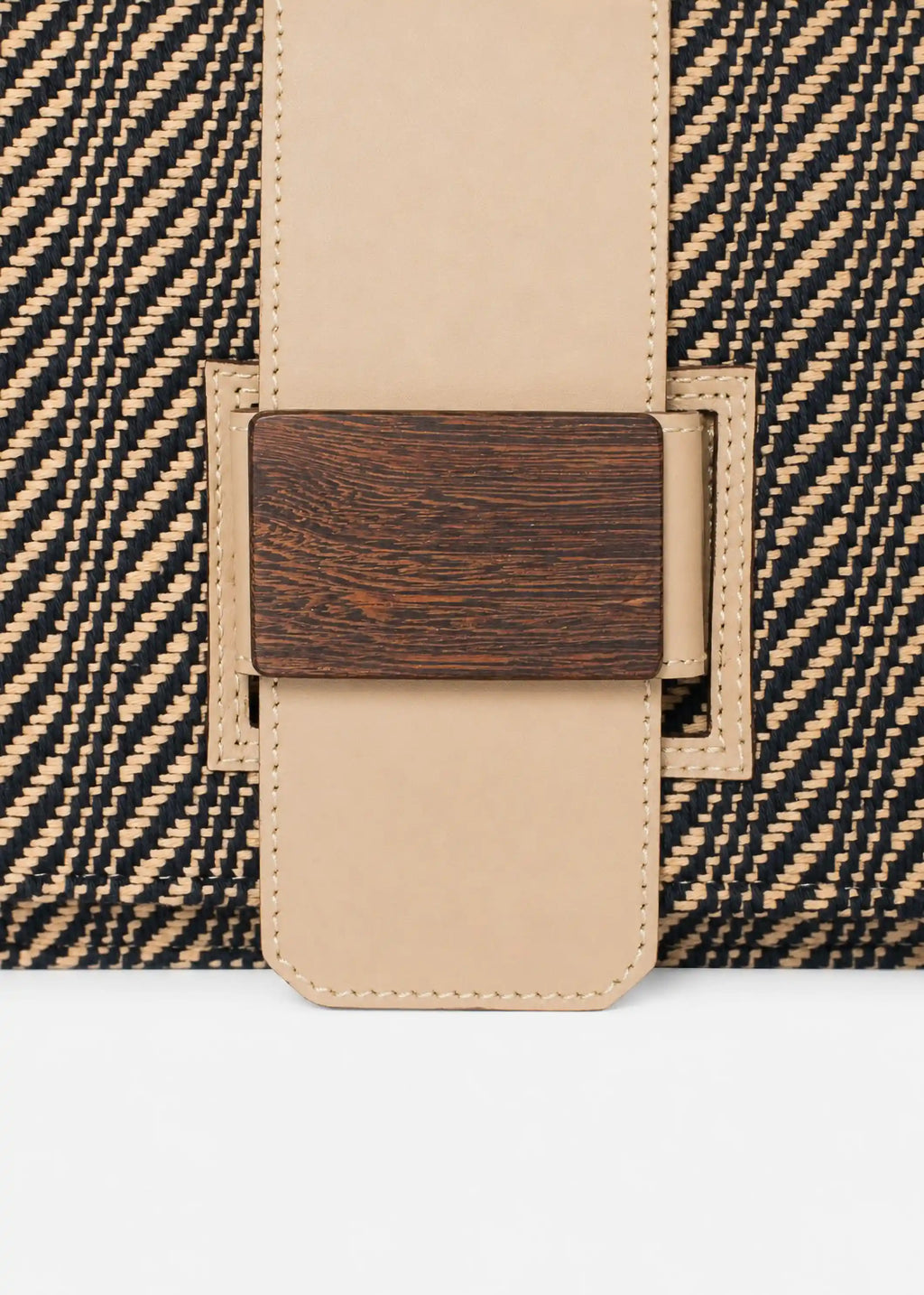 Close-up of reclaimed rosewood buckle and Twist Dusk handwoven cotton weave on Berlin crossbody bag