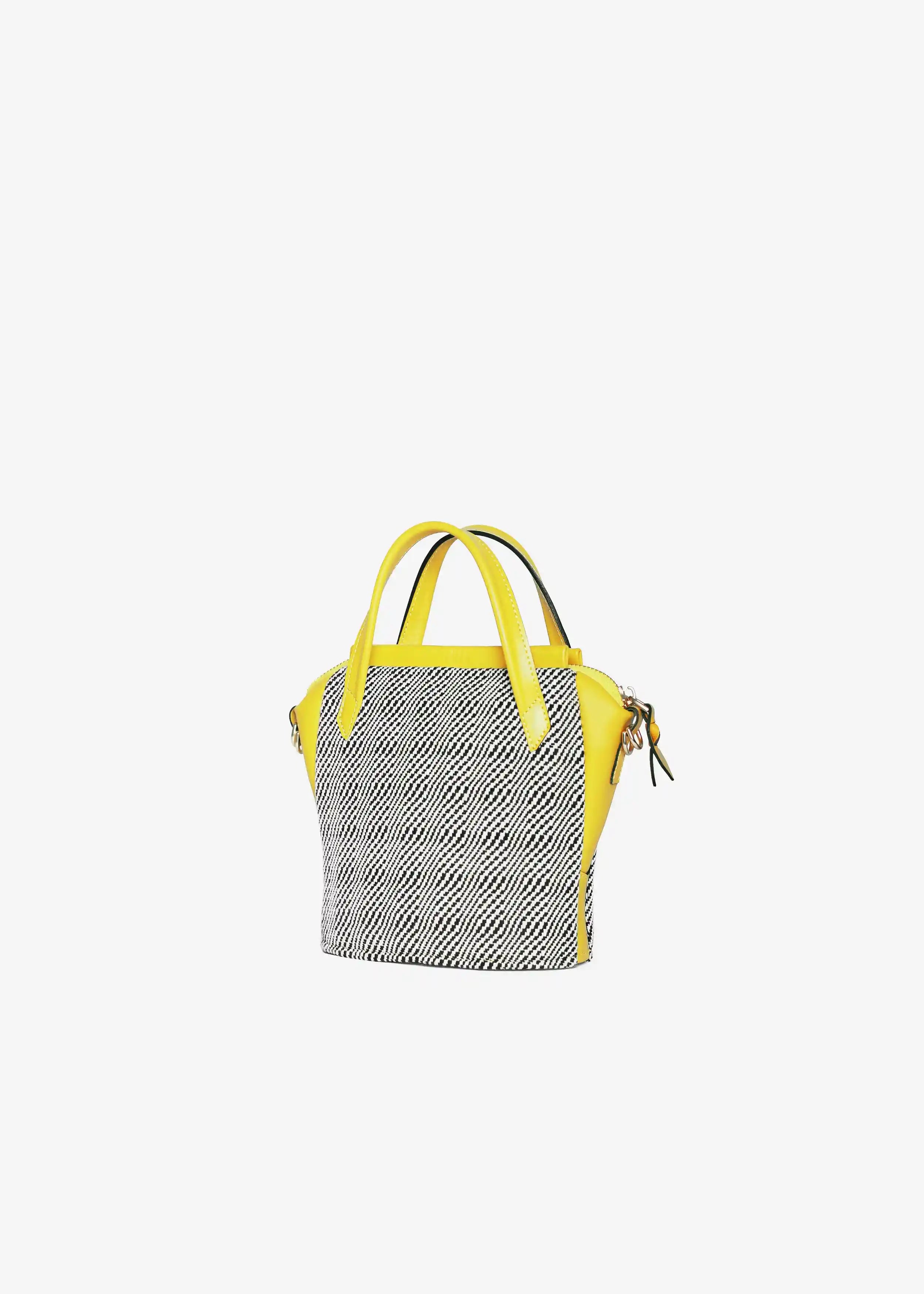 Chicago Mini Rise Salt & Pepper bag side profile — tapered structure with yellow leather and adjustable strap
