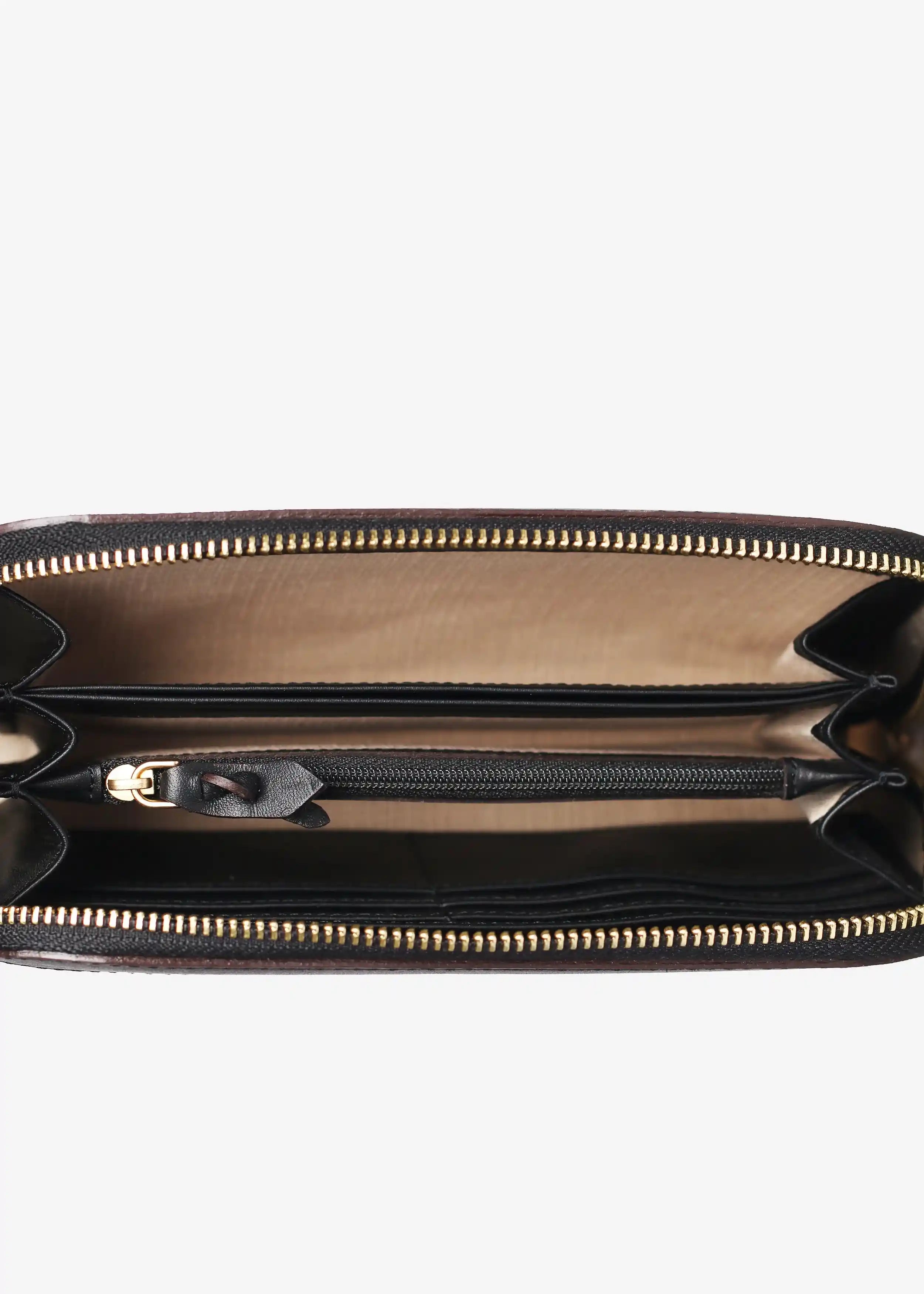 Detail → Paris Peak Noir bag interior detail showing 6 card pockets, dividers and zipper pocket in leather-lined interior