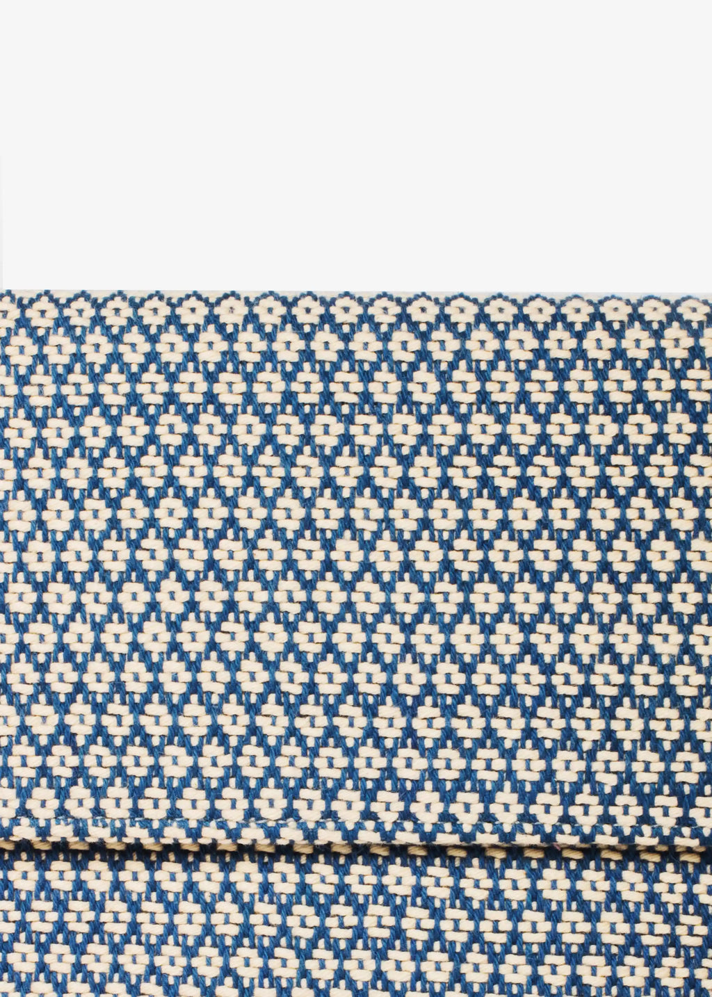 Close-up of Align Topaz handwoven cotton weave on Venice crossbody bag