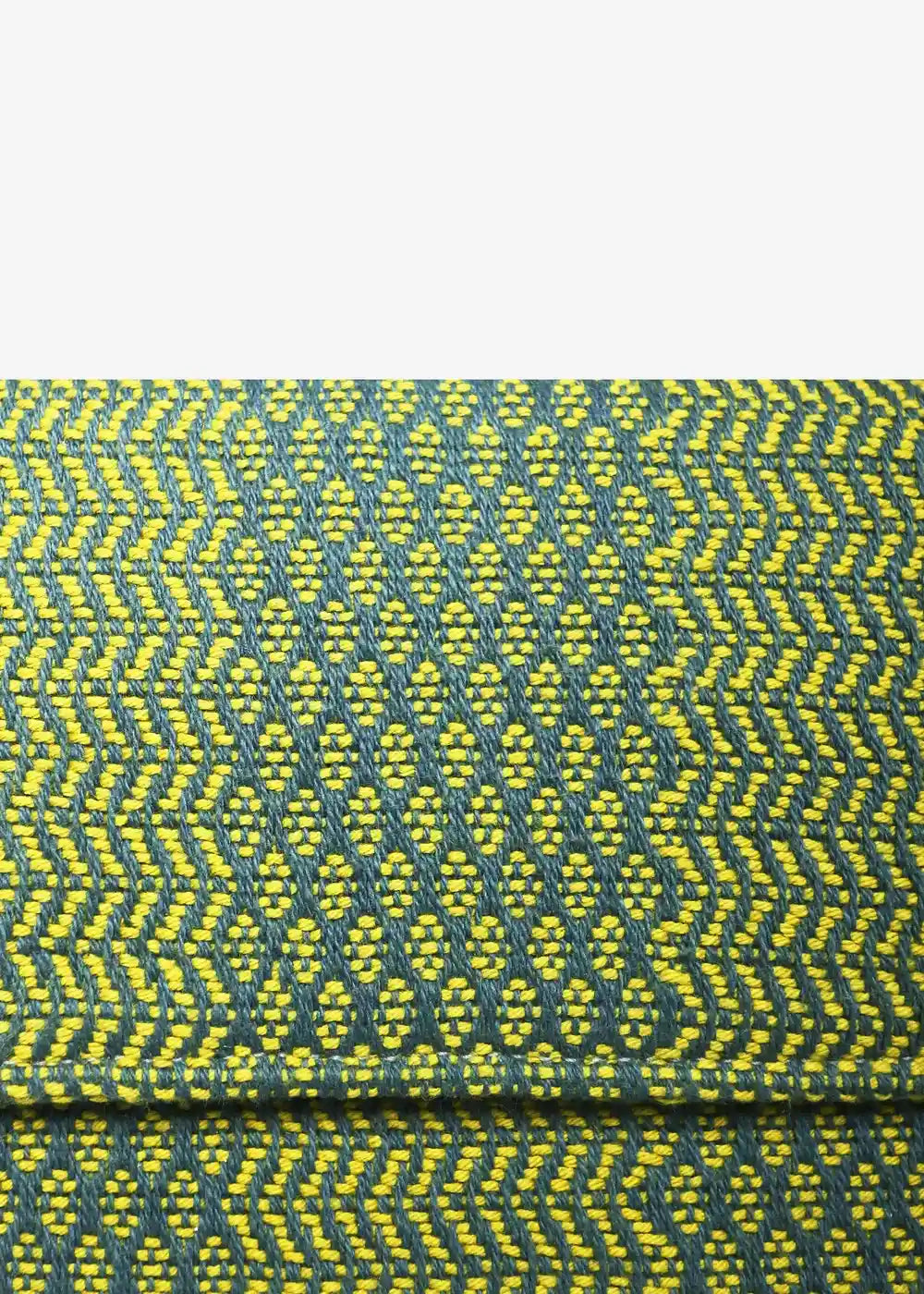 Close-up of Dream Green Mango handwoven cotton weave on Venice crossbody bag