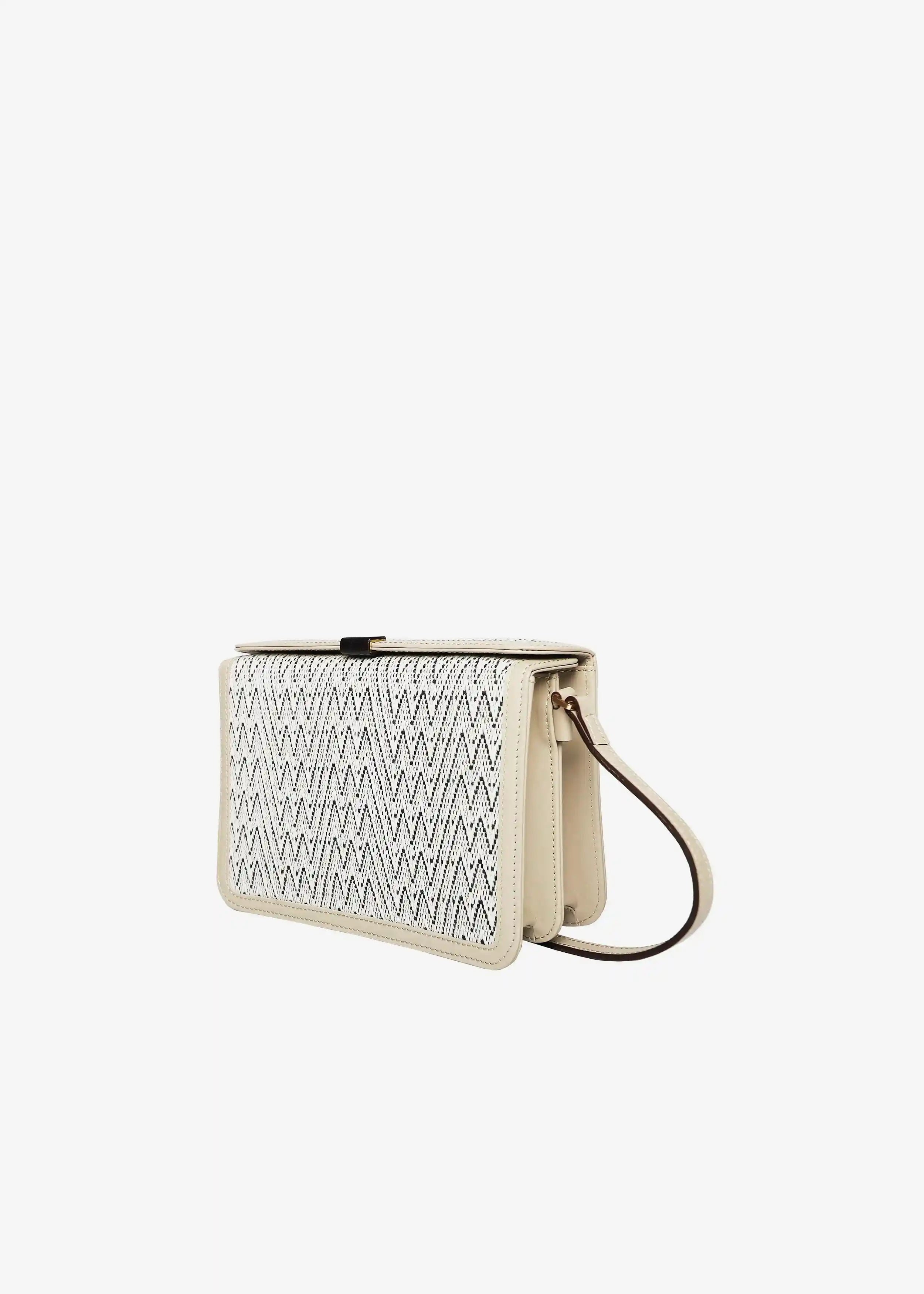 Zürich Peak Mountain Snow crossbody bag angled view — compact structured body with cream nappa leather and rosewood closure