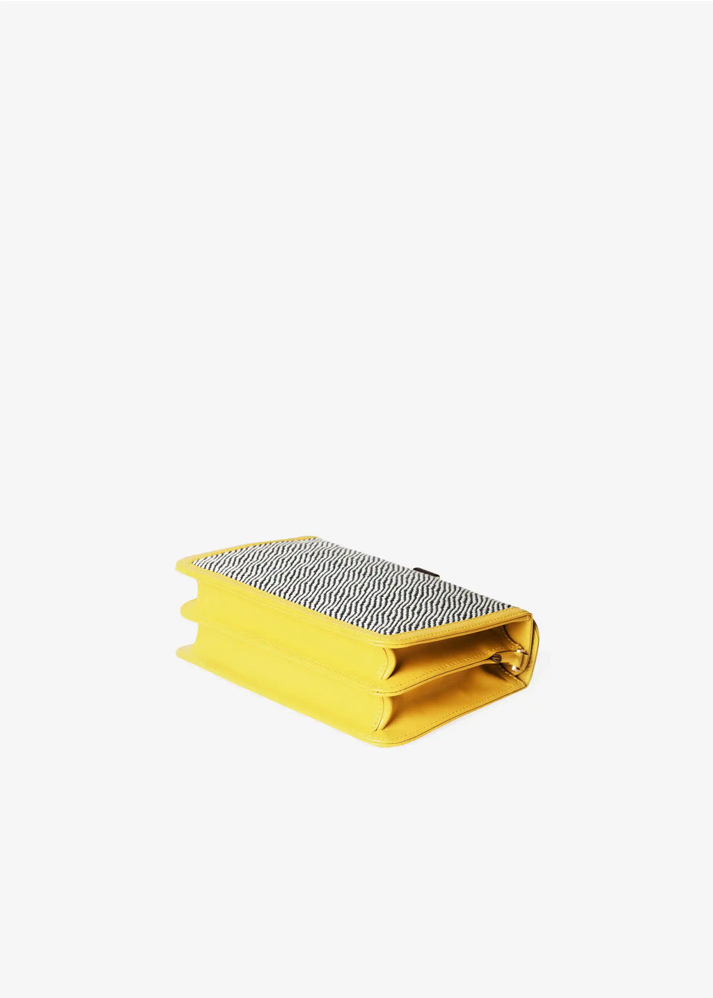 Zürich Rise Salt & Pepper crossbody bag laid flat showing structured accordion body and yellow nappa leather trim