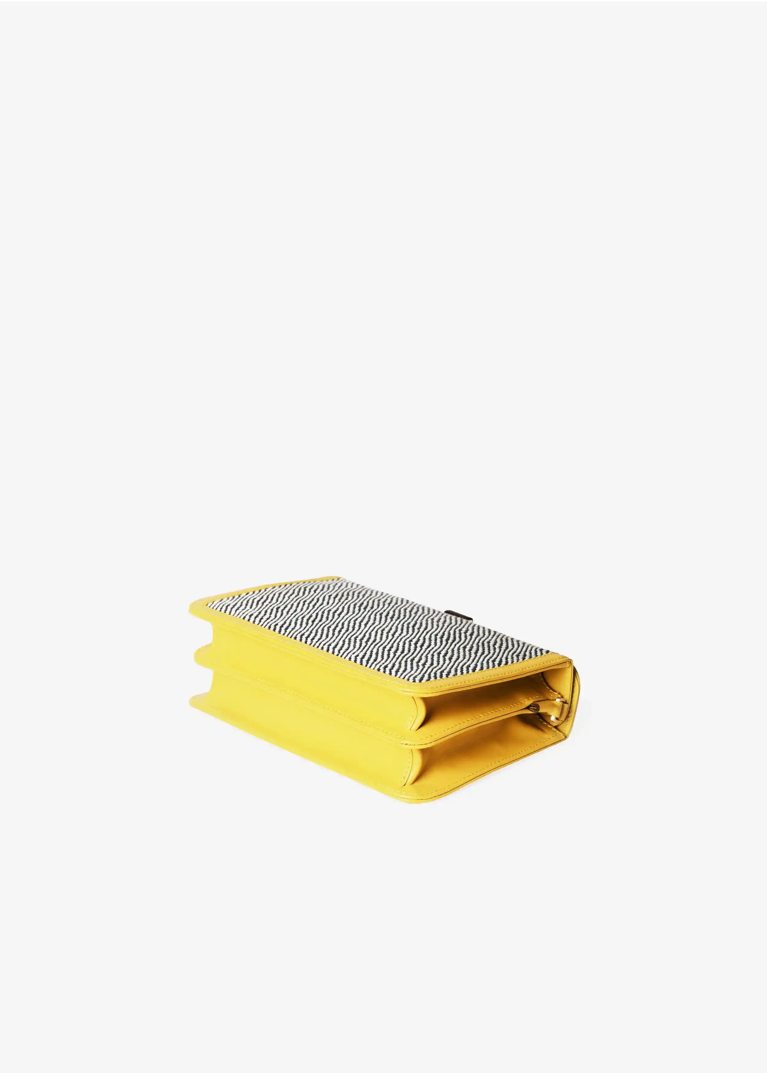 Zürich Rise Salt & Pepper crossbody bag laid flat showing structured accordion body and yellow nappa leather trim