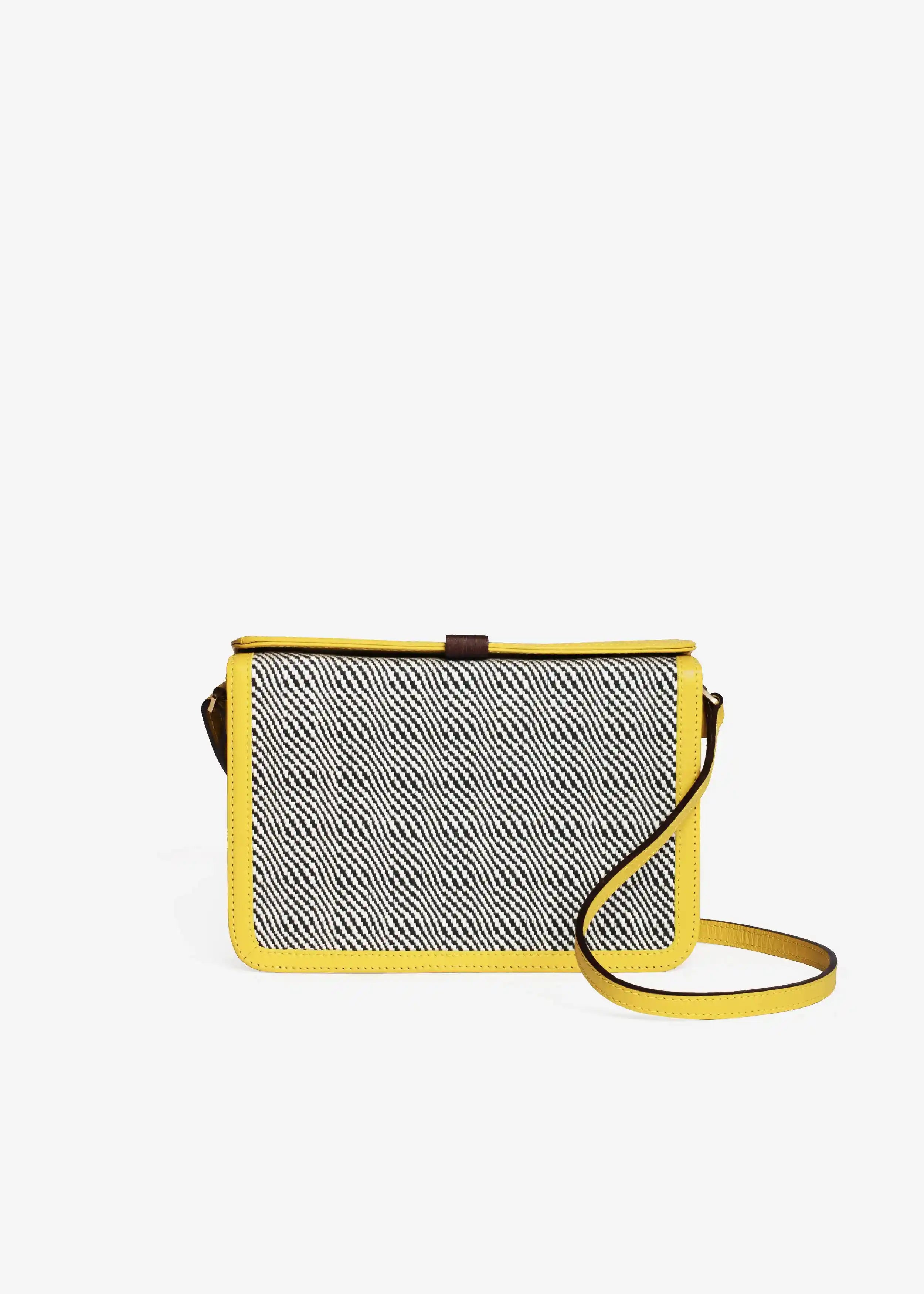 Zürich Rise Salt & Pepper crossbody bag front — handwoven cotton weave with yellow nappa leather and reclaimed rosewood tab closure