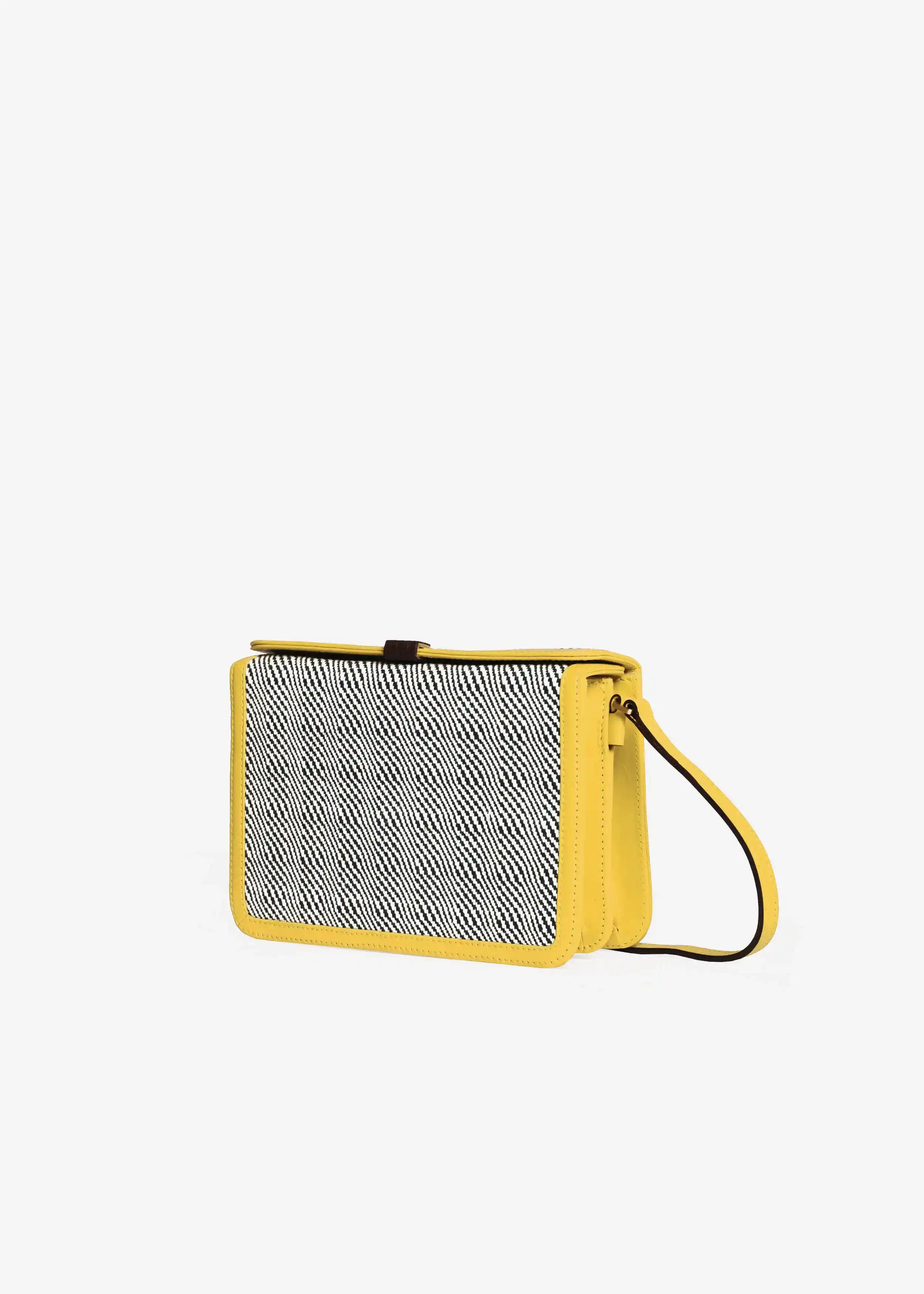 Zürich Rise Salt & Pepper crossbody bag perspective 3/4 view — handwoven cotton weave with yellow nappa leather trim