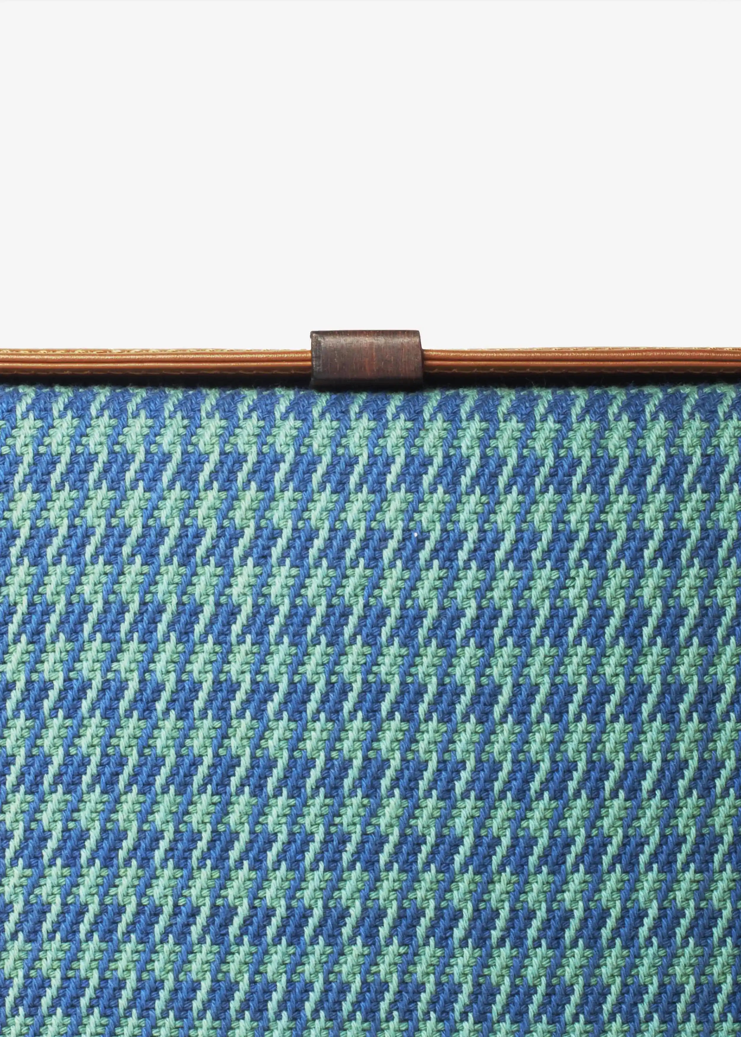 Close-up of Sing Peacock handwoven cotton weave on Zürich crossbody bag