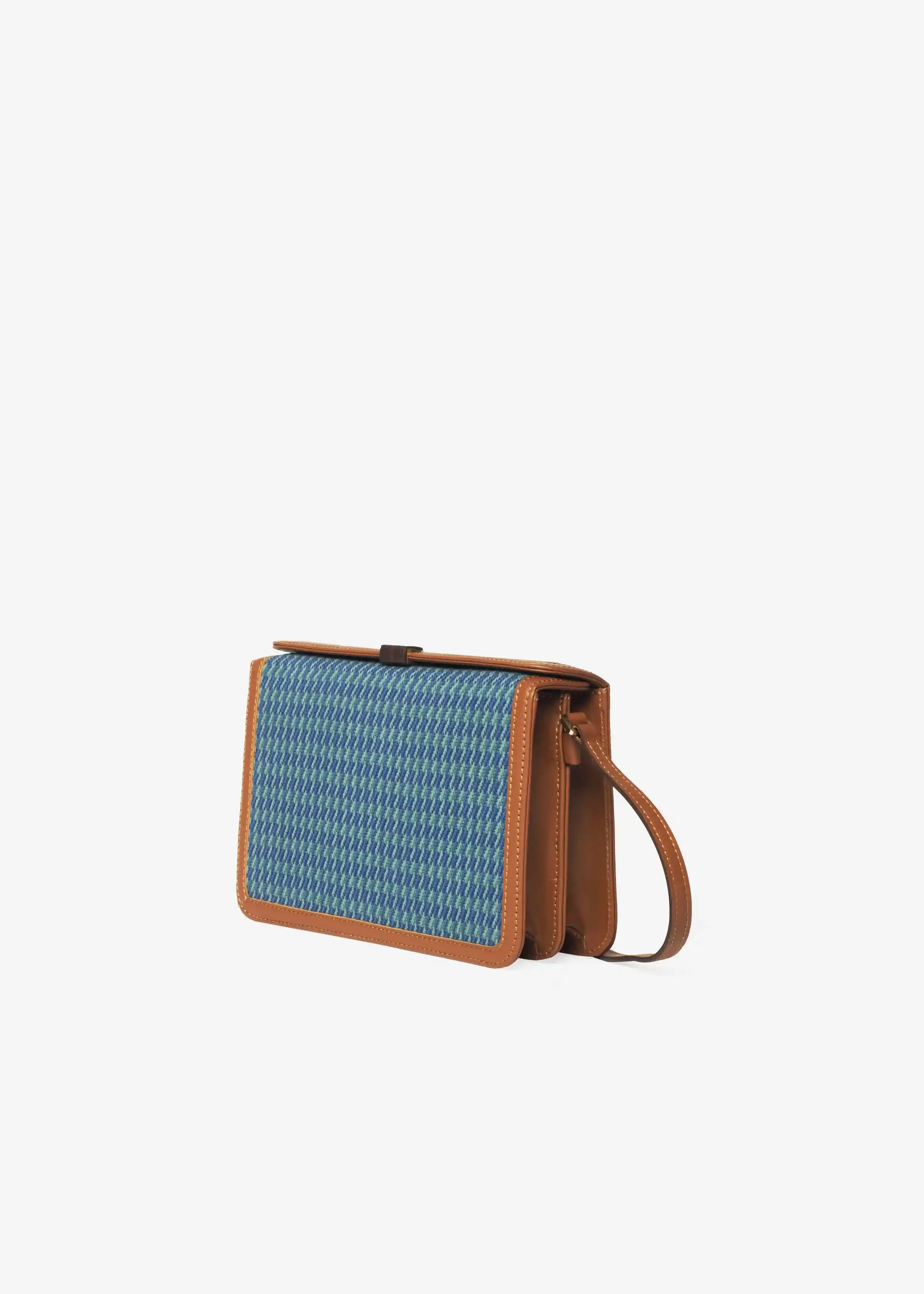 Zürich Sing Peacock crossbody bag perspective 3/4 view — handwoven cotton weave with brown nappa leather trim