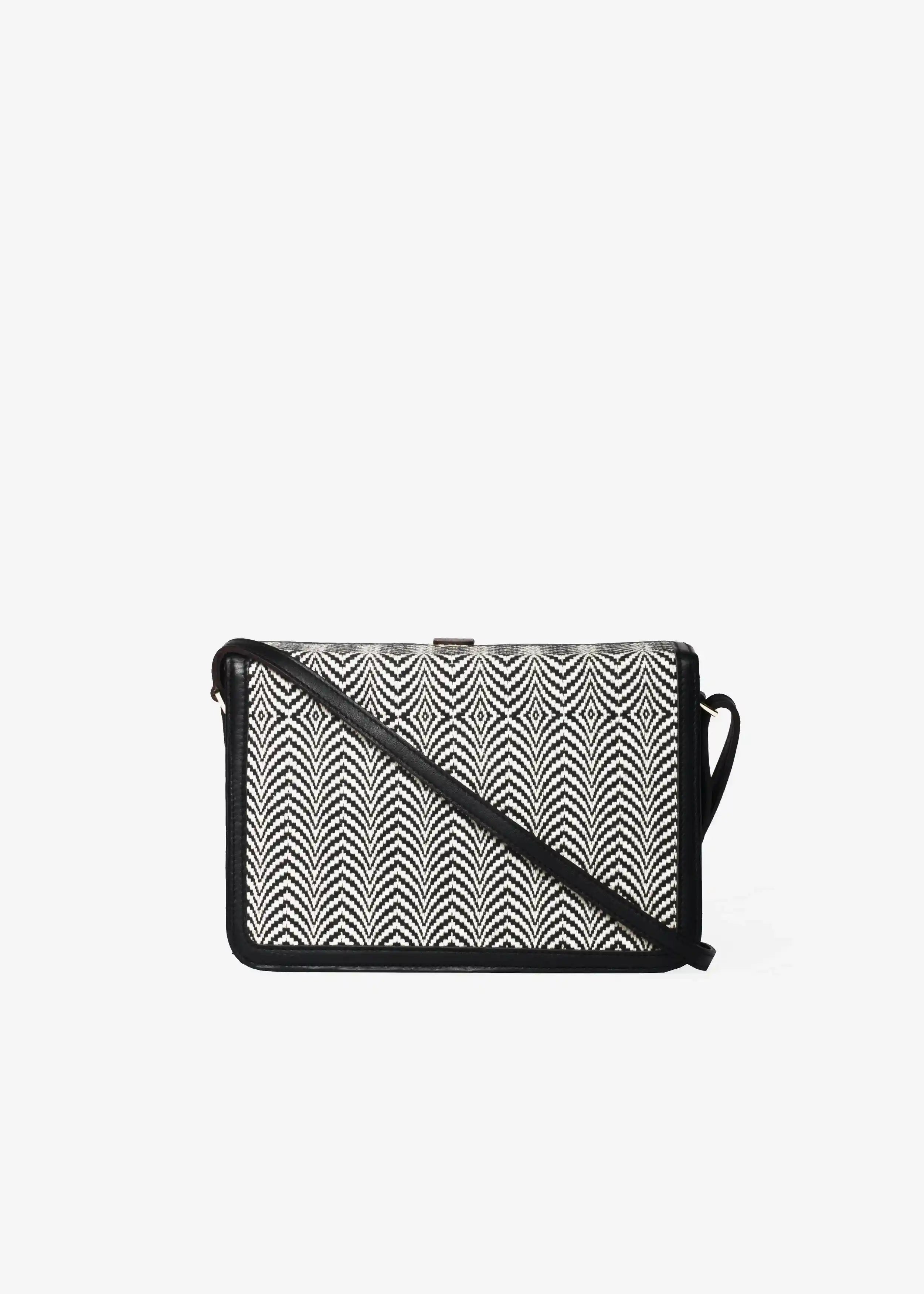 Zürich Sizzle Salt & Pepper crossbody bag back view — black genuine nappa leather with matte gold hardware