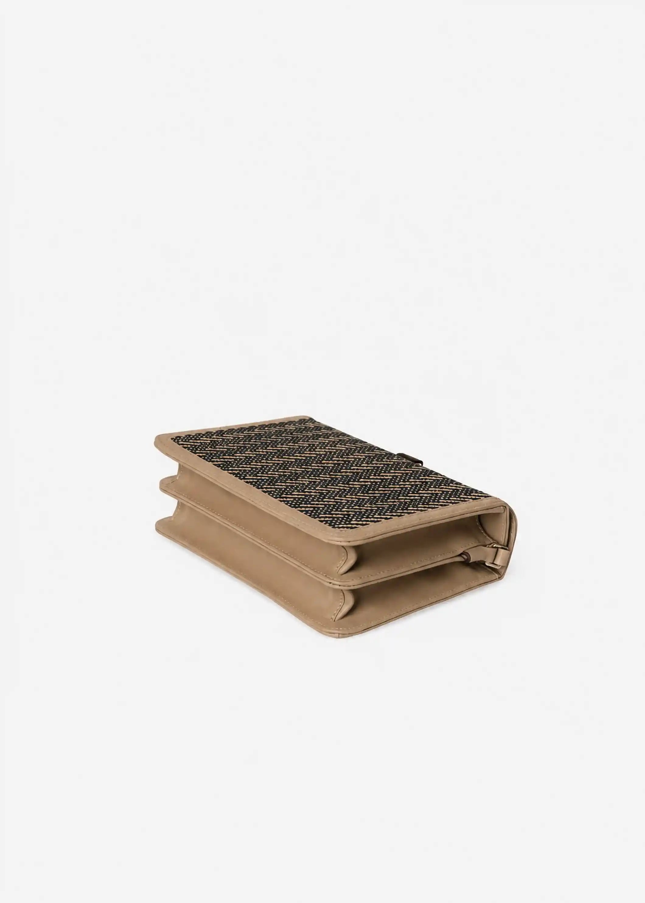 Zürich Twist Dusk crossbody bag laid flat showing structured accordion body and beige nappa leather trim
